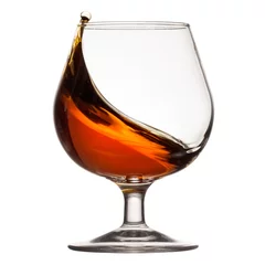 Fotobehang Alcohol Splash of cognac in glass