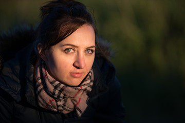 Beautiful young woman in a wheat golden field