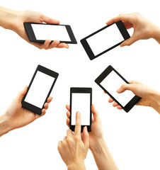 Hands holding smart phones isolated on white