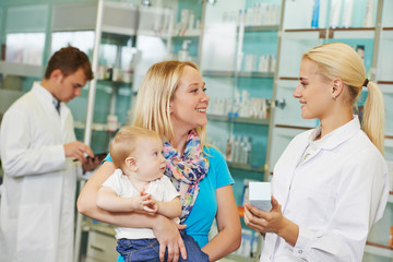 Pharmacy chemist, mother and child in drugstore