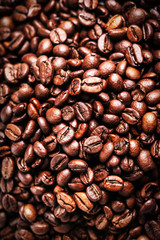 Brown coffee beans. Roasted coffee beans for background and text