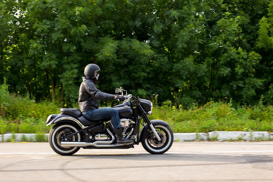 Fototapeta slow motion, biker riding unknown motorbike with blur movement,