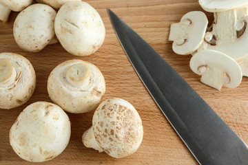 Fototapeta na wymiar Mushrooms on cutting board