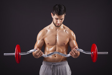Fitness man lifting weights with curl bar