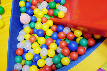 Fototapeta na wymiar Colorful plastic balls from the children's playground