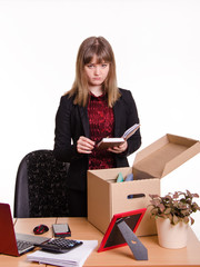 Dismissed girl puts personal belongings in office