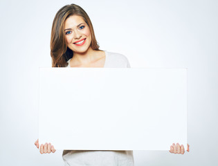 smiling woman holding blank business sign board.
