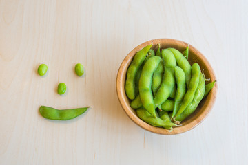 Japanese green soybeans on the wooden table.