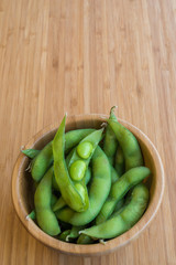 Japanese green soybeans on the wooden table.