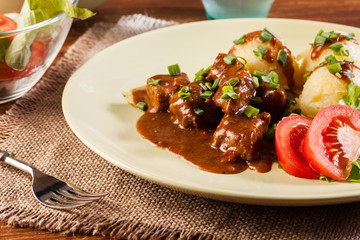 Goulash with boiled potatoes