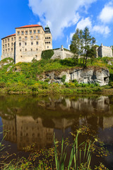 Fototapeta na wymiar Beautiful Pieskowa Skala castle located by small lake, Poland