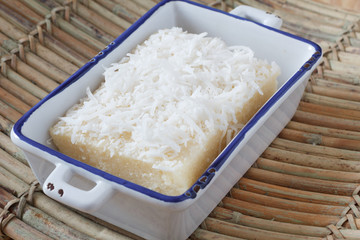 Brazilian sweet cuoscous (cuscuz doce) with coconut ion plate