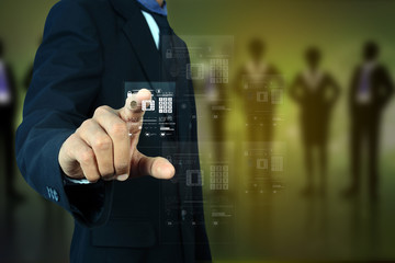 Businessman pressing virtual buttons