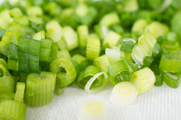 Background of chopped green shallots close-up studio shot