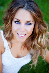 Fototapeta premium Cool pretty woman lying on the grass
