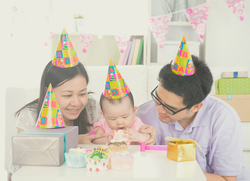 Asian Parent With Baby During Birthday