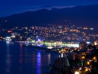 Mountains city at night. Black sea