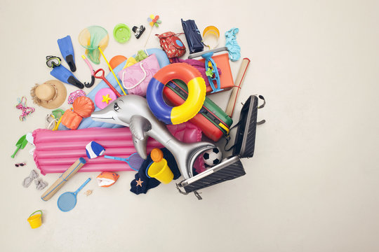 Germany, Artificial scene with beach toys coming out of baggage