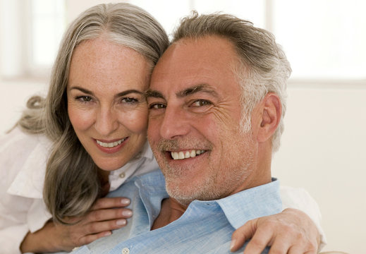 Mature couple smiling, portrait, close-up