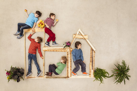 Kids playing outdoor, building wooden hut
