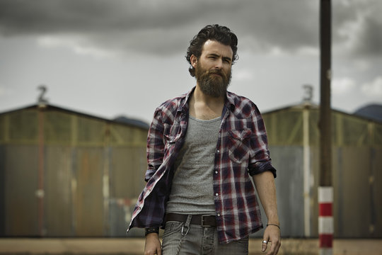 Serious man with full beard 