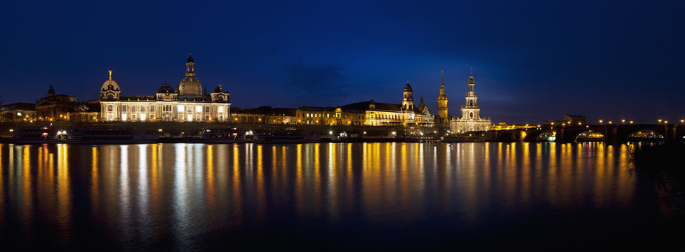 Germany, Saxony, Dresden, View of skyline of Staendehaus, Frauenkirche, Katholische Hofkirche, Semperoper, Bruehl's Terrace, Dresden Castle and Augustus bridge with Elbe waterfront at night