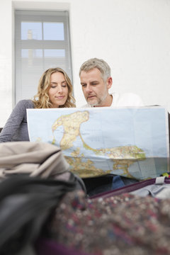 Germany, Leipzig, Couple looking at map
