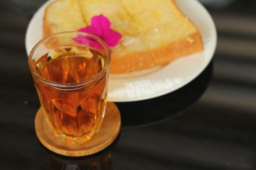 Bread, butter, topped  milk with tasty and tea
