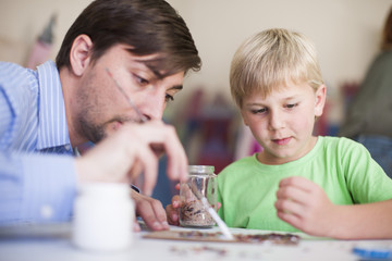 Teacher and boy in art class