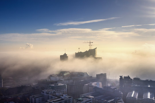 Germany, Hamburg, aerial view of the Elbphilharmonie and city in dense fog
