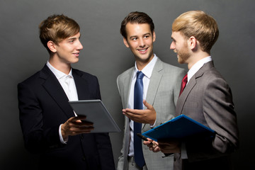 Three young man discuss ion isolated