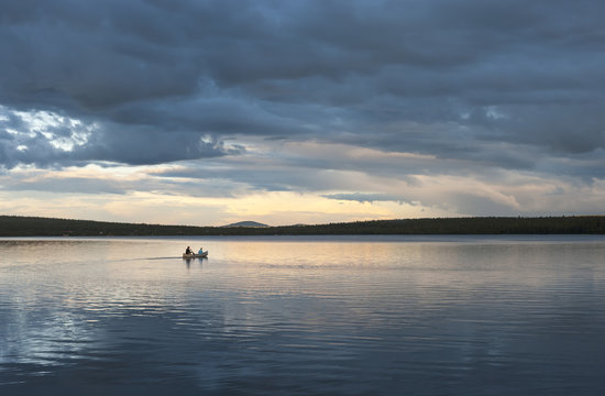 Sweden, Lapland, Norrbotten County, Kiruna, canoeing father and son
