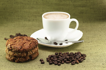cup of cappuccino, coffee and biscuits