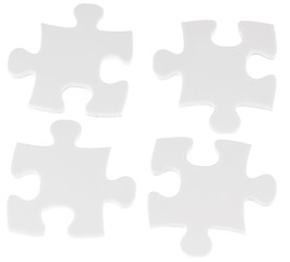 Fototapeta premium quatre pièces de puzzle sur fond blanc