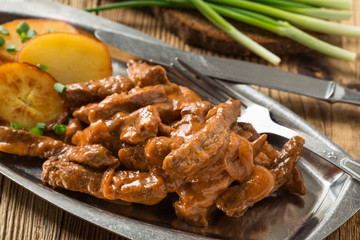 Beef Stroganoff, strips of beef in sour cream served with crisp