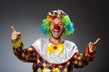 Funny clown in colourful costume