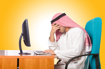 Arab businessman working on computer