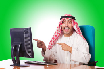 Arab businessman working on computer