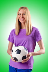 Woman playing football on white