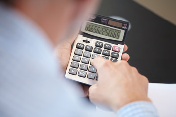 businessman with calculator