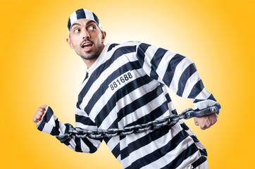 Convict criminal in striped uniform