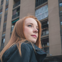 Beautiful girl posing in the city streets