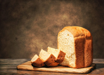 Fresh homemade bread on a brown background