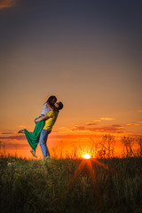 silhouette of couple at sunset