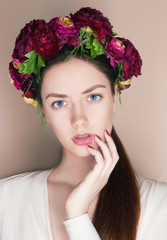 Beautiful young womanl with flowers hairstyle