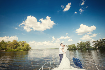 Bride and groom on a yacht