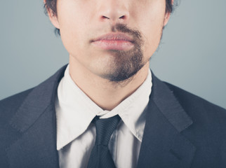 Businessman with half shaved beard
