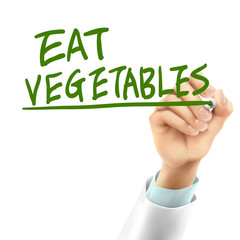 Fototapeta premium doctor writing eat vegetables words