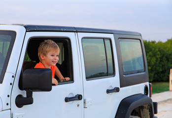 little boy in off-road car, family vacation