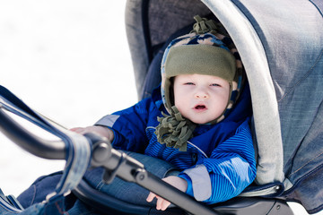 Cute little baby in a stroller outdoor